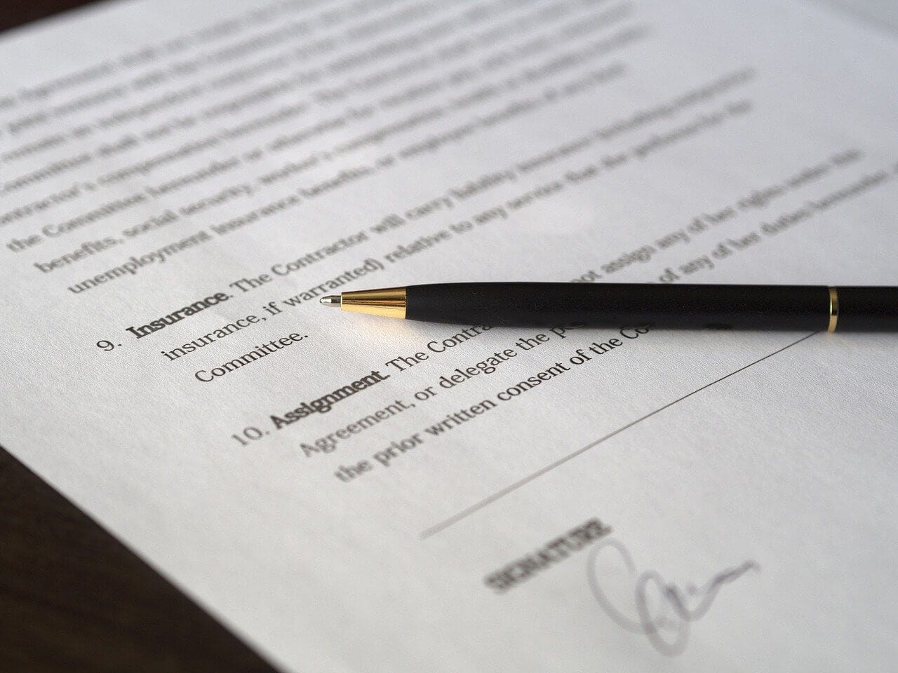 A close up photograph of a signed document